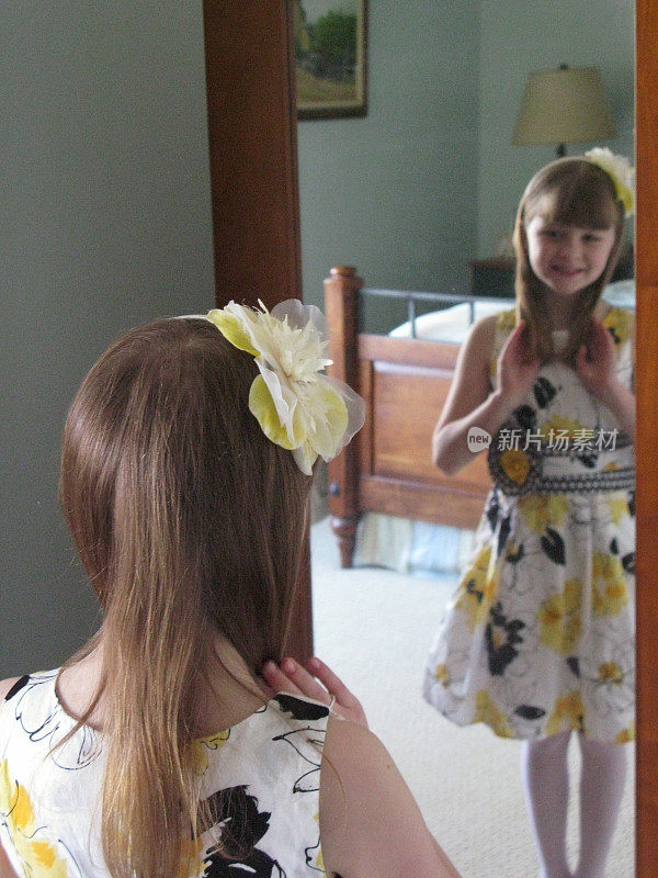 7, 8 Year Old Girl in Dress Looking In Mirror